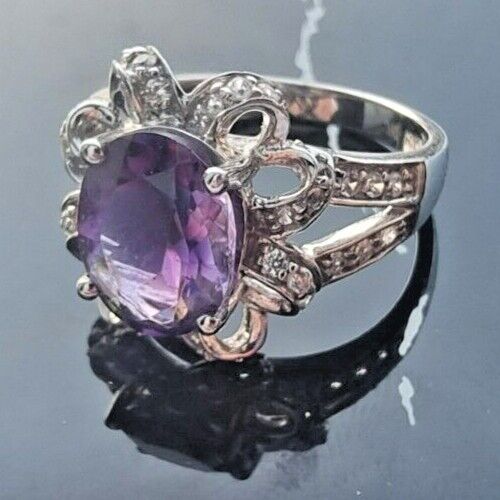 925 STERLING SILVER OVAL  10x 7.6 mm. AMETHYST AND CZ RING SIZE 6.25 AT