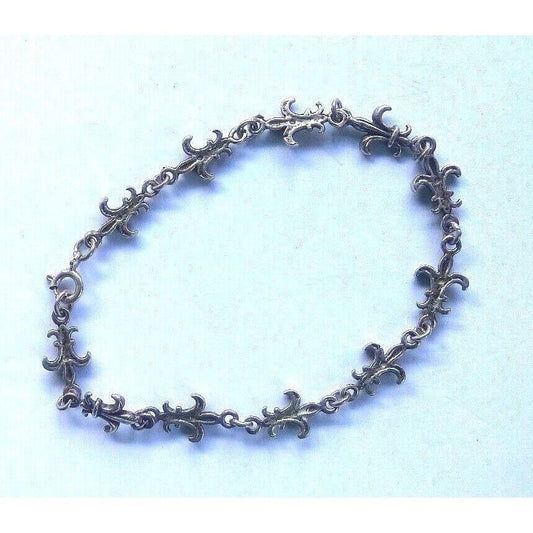 STERLING SILVER FLEUR-DE-LIS LINK BRACELET. SKY