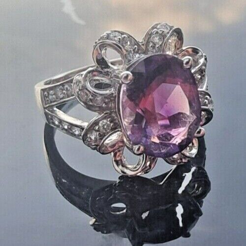 925 STERLING SILVER OVAL  10x 7.6 mm. AMETHYST AND CZ RING SIZE 6.25 AT