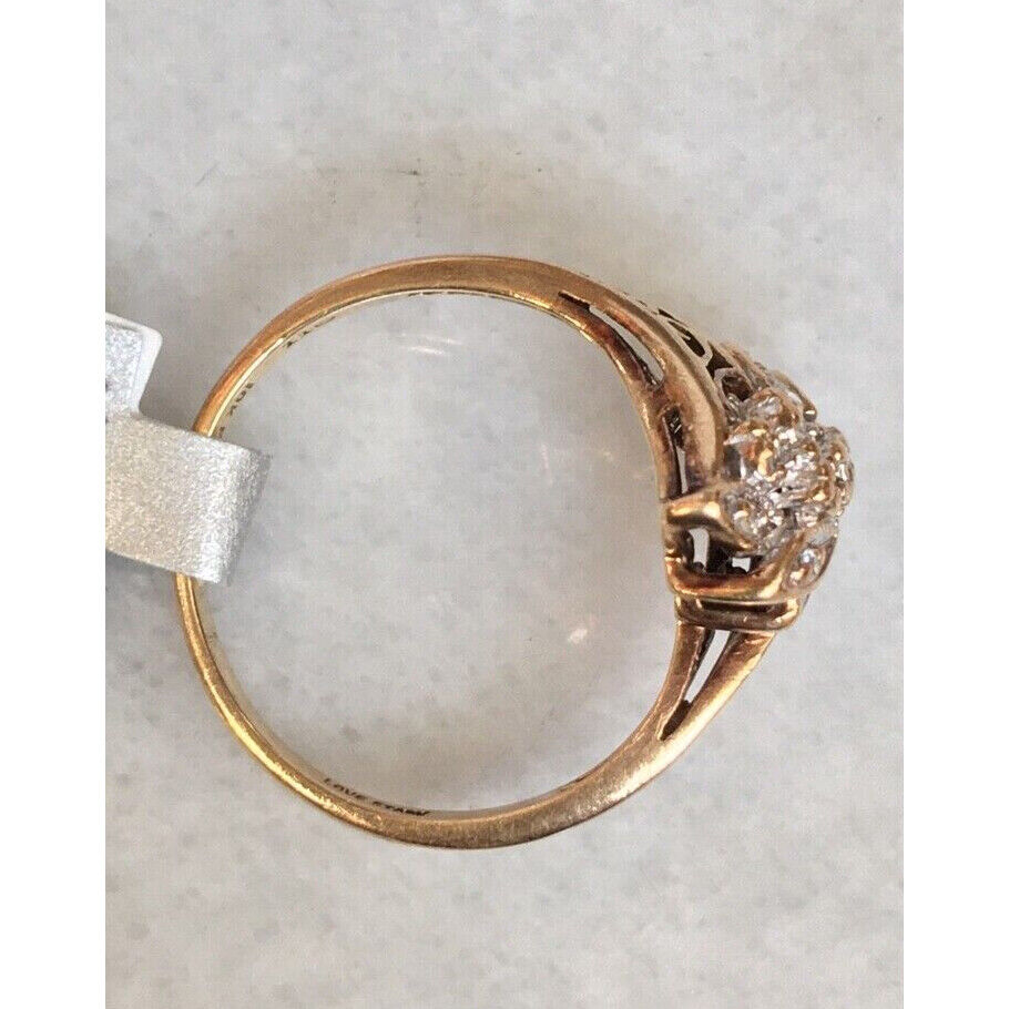 YELLOW GOLD "LOVE STORY" 0.15 CT DIAMOND CLUSTER RING. SIZE 6.75 SKY