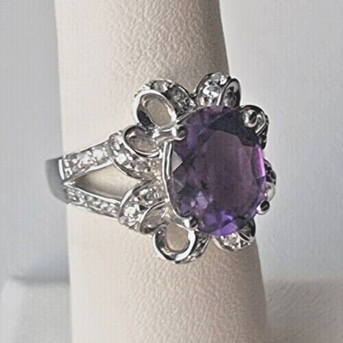 925 STERLING SILVER OVAL  10x 7.6 mm. AMETHYST AND CZ RING SIZE 6.25 AT