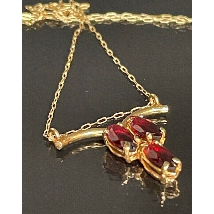 14K YELLOW GOLD AND GARNET NECKLACE SKY