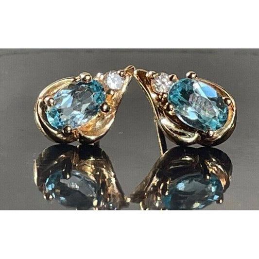 YELLOW GOLD  SKY BLUE TOPAZ STUD EARRINGS SKY